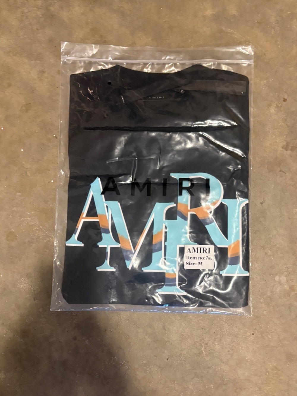 AMIRI Black Short Sleeve Logo Tee with Turquoise and Orange Accents